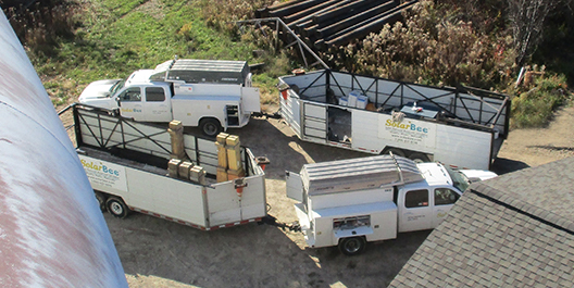 SolarBee GridBee service vehicles on a tank location