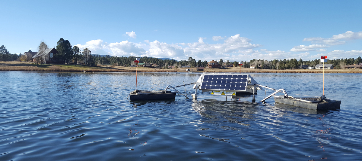 A SolarBee Circulator in the middle of a home owners lake